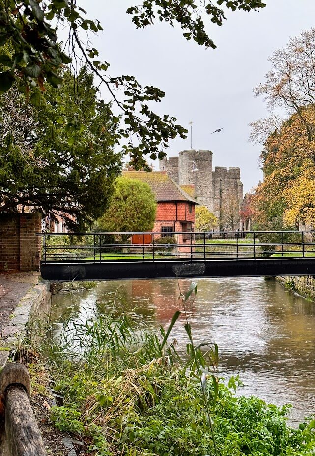 Westgate Gardens and the River Stour with Westgate Towers in the background, Canterbury, Kent.