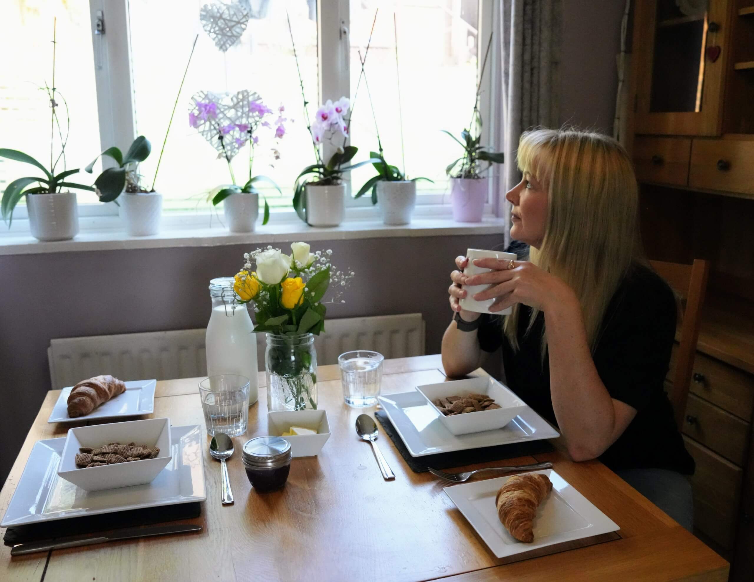 Becky Stone enjoying breakfast at home, reflecting the warm and welcoming environment provided by Home From Home Canterbury for international students.