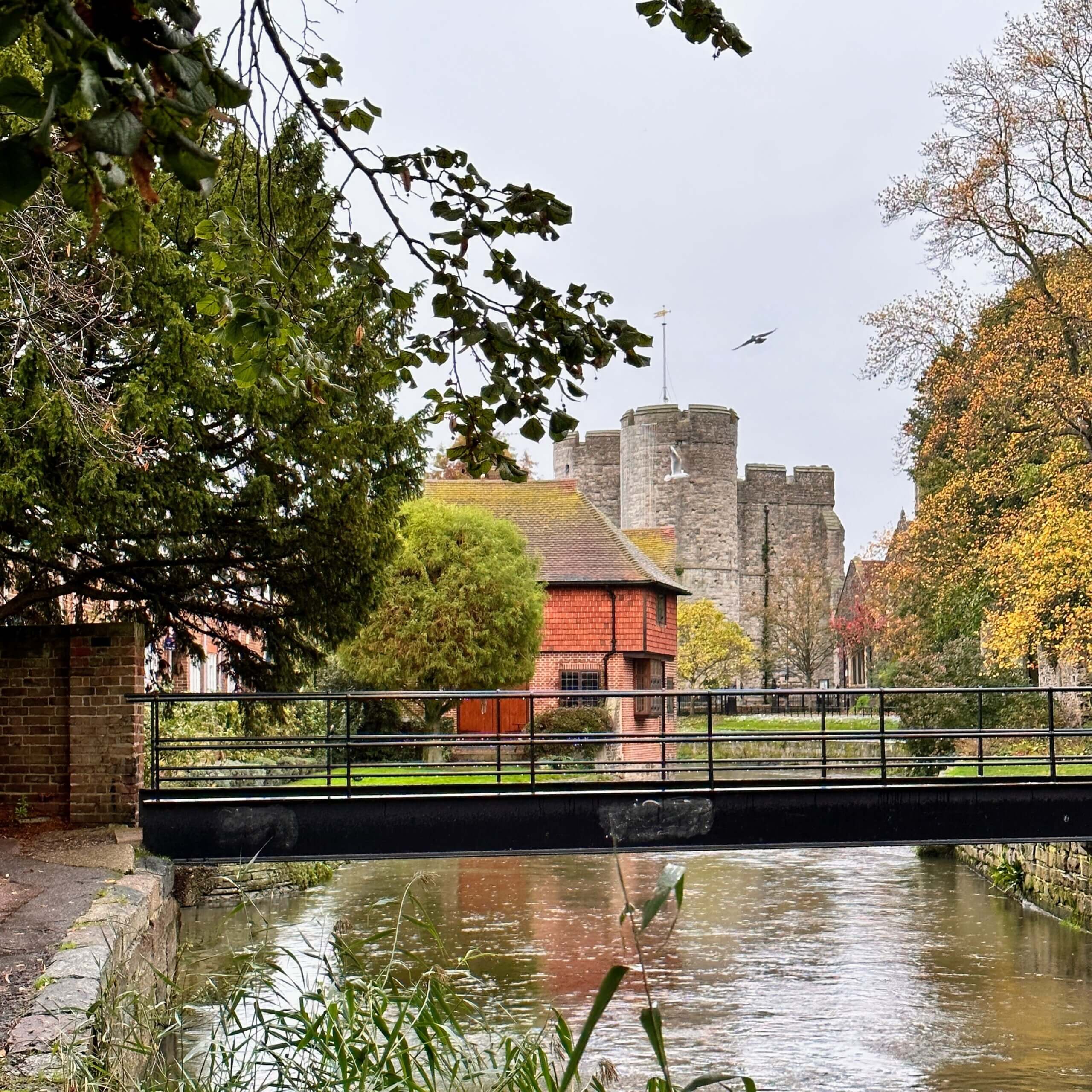 Westgate Gardens and the River Stour with Westgate Towers in the background, Canterbury, Kent.